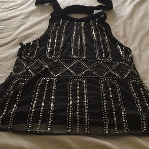 Sleeveless tie back high neck party top